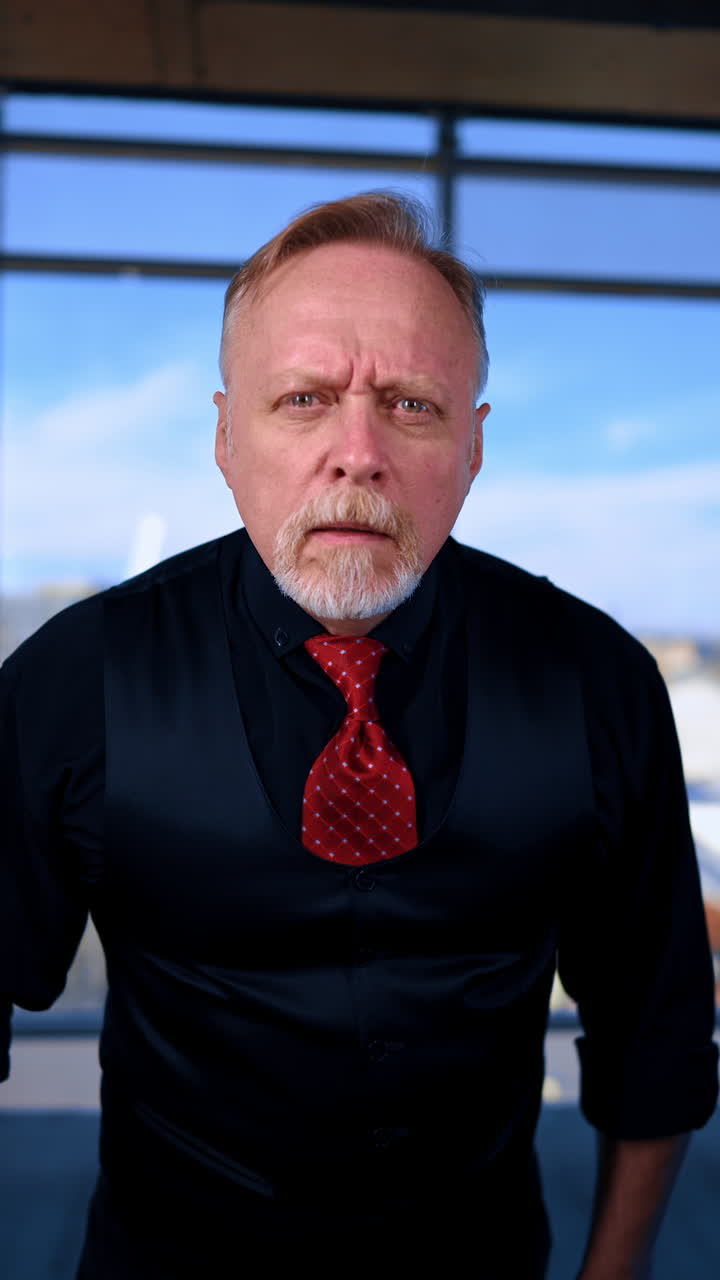 Confident mature business person. Stylish handsome man at office working. Vertical video.