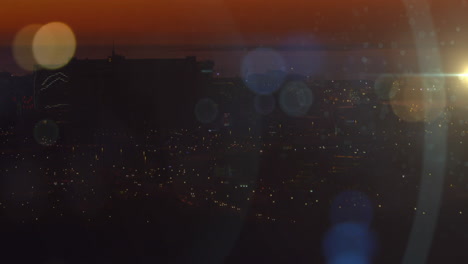 animation of light spots and trails over cityscape