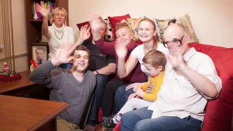 Happy-big-family-waving-with-their-hands