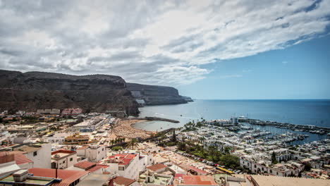 timelapse of a nice summer day on gran canaria with a panoramic view over the famous city of puerto de mogan