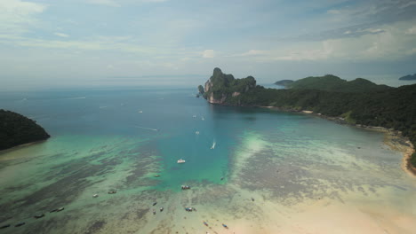 aerial view of tropical islands and turquoise bay with boats