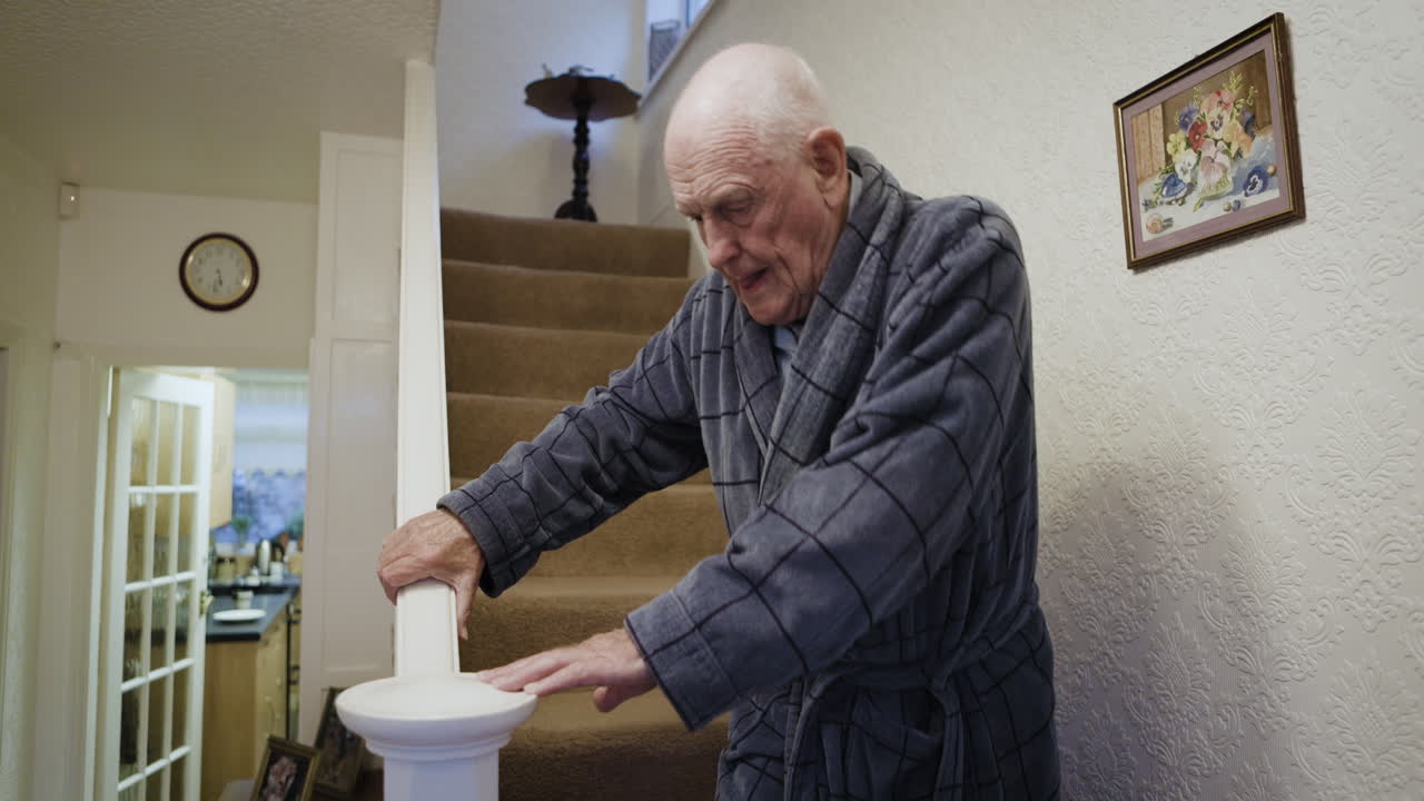 Elderly man on stairs at home
