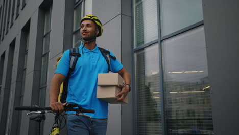 delivery person with packages and bicycle