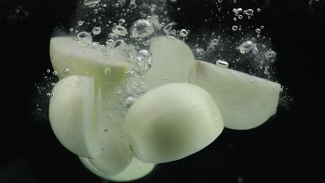 onion slices in water splash