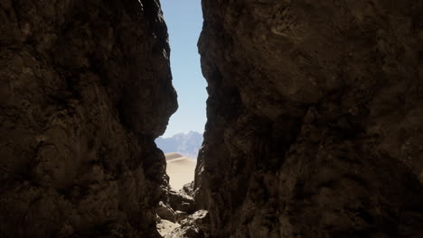 a view of a desert canyon with mountains in the distance