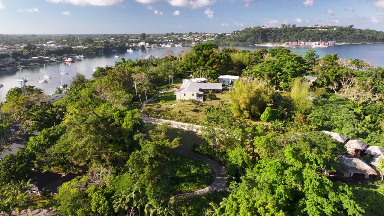 Drone flyover paradise island resort on Port Vila shore in Vanuatu. Travel destination, vacation.