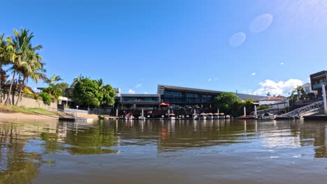 scenic canal view with restaurant and boats