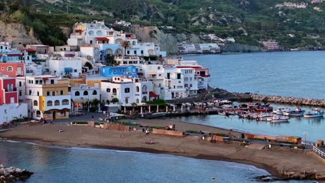 white houses on the ocean coast of sant’angelo, touristic island ischia in italy