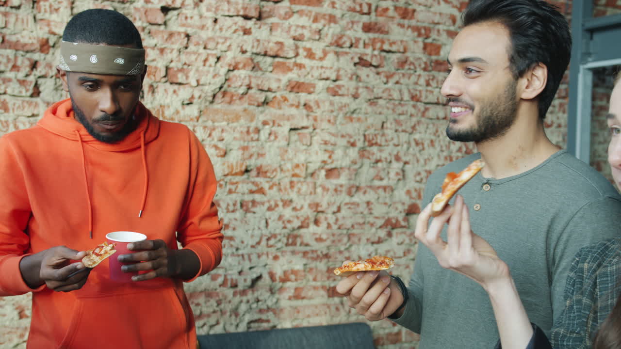 Friends Enjoying Pizza and Conversation