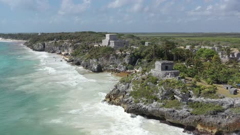 mayan archaeological complex on waterfront cliff of tulum in mexico