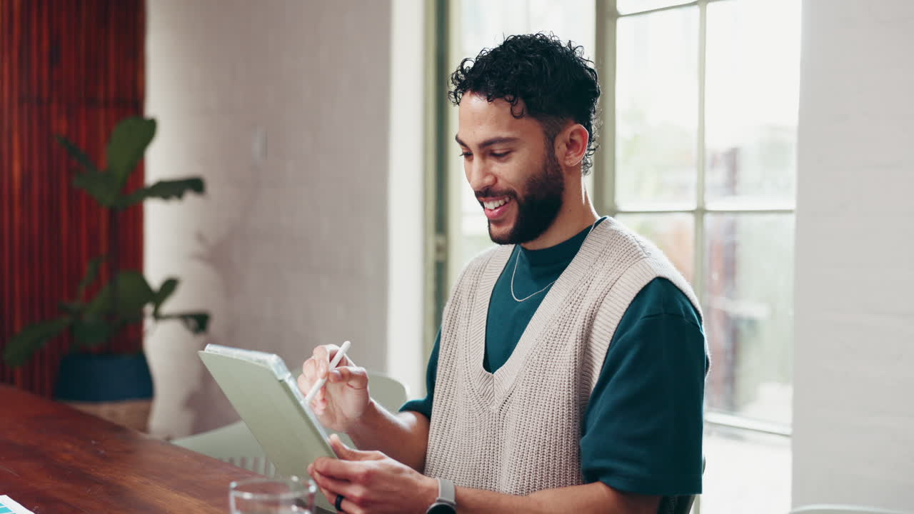 Man working on digital art at a table