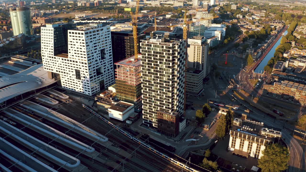 Low traffic on train tracks, streets and roads around central train station of Utrecht city during lock down for containment of Corona virus, Netherlands. Aerial