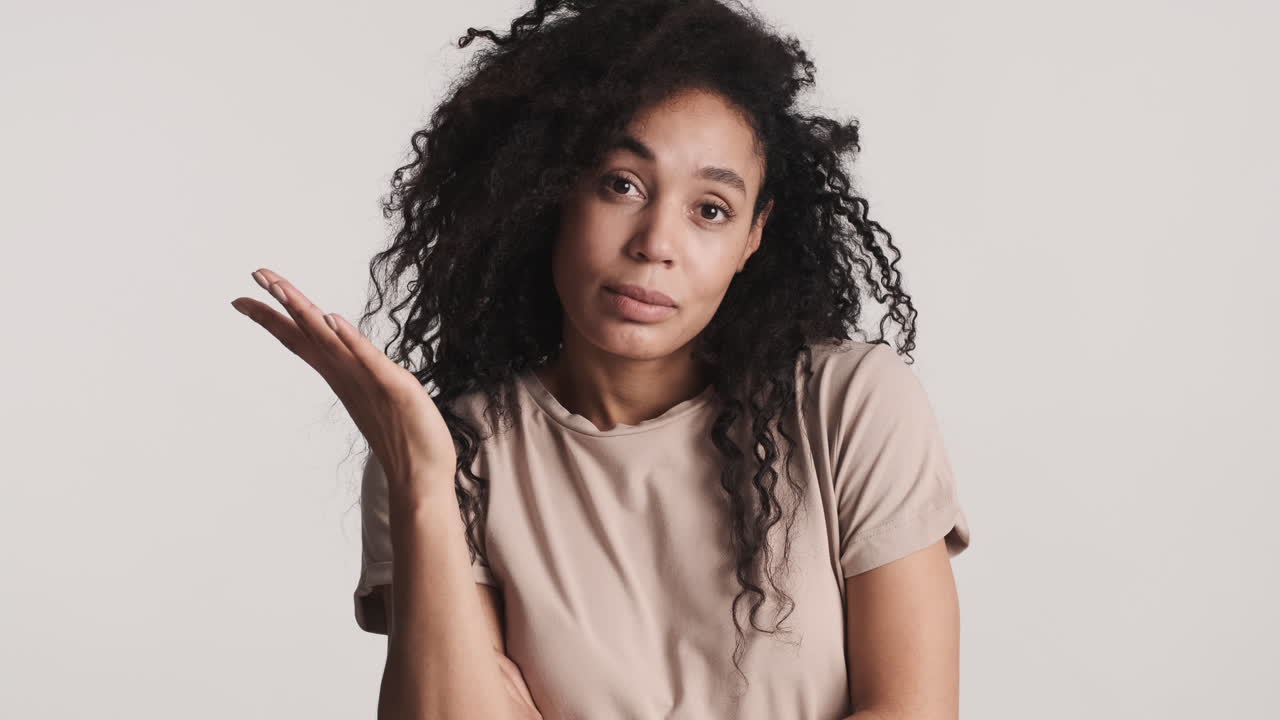 African american thoughtful woman over white background.
