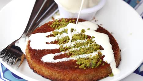 kunafa with a wipe cream on a plate