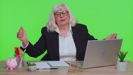 tired sleepy overworked senior business woman falling asleep sit at office desk with laptop