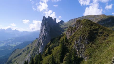 unique-mountain-formation-scenery-in-the-swiss-alps,-saxer-luecke-alpstein-aerial-fly-over