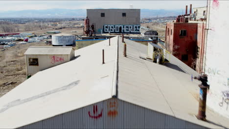 Fly-over-view-of-sugar-mill-warehouse-in-rocky-mountains