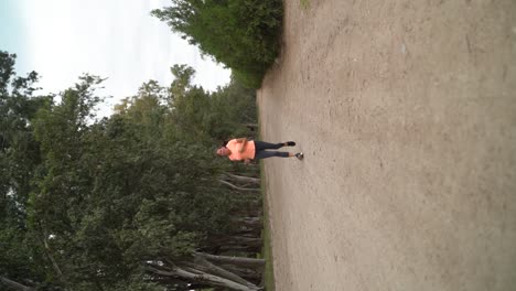 A-Woman-is-Running-in-the-Park---Vertical-Shot