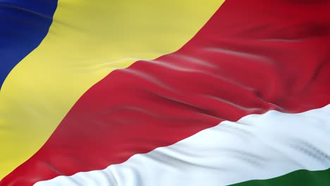 bandera de las seychelles ondeando en el viento con textura de tela muy detallada. bucle sin costuras
