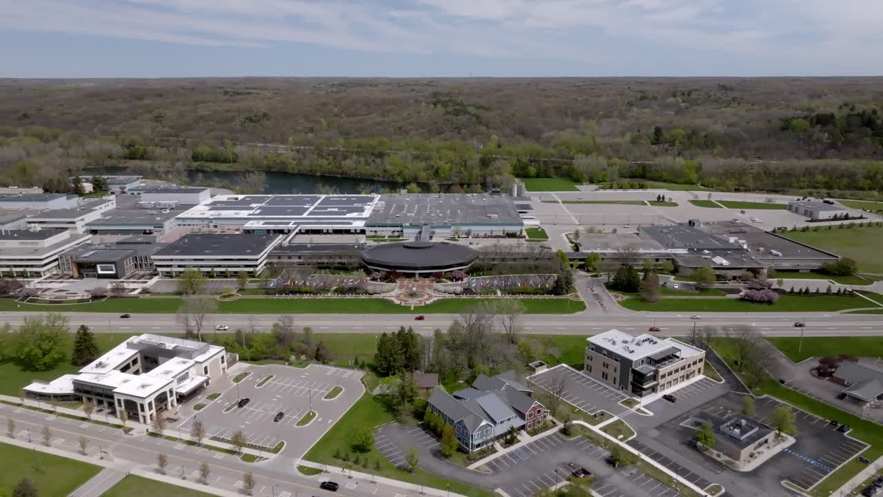 Amway North American Headquarters building in Ada, Michigan with drone video moving in.