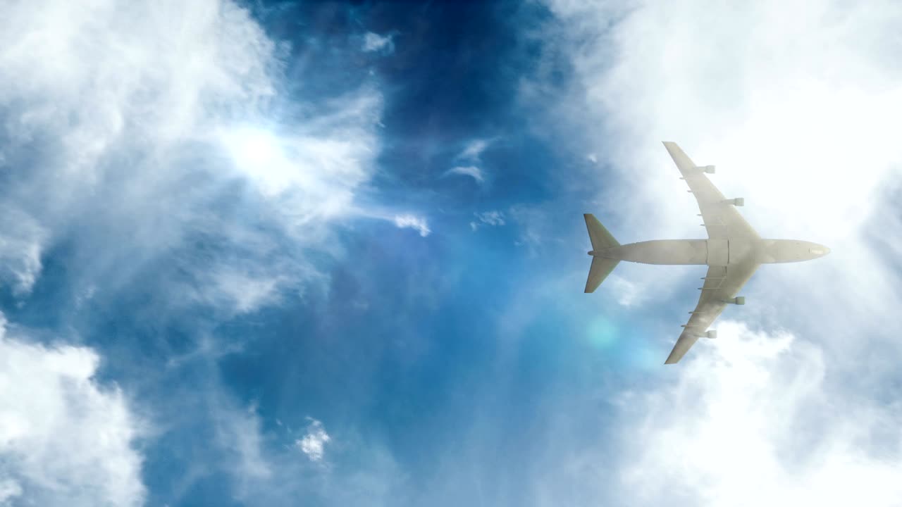 avión vuela por el cielo azul de un día soleado. bucle de video