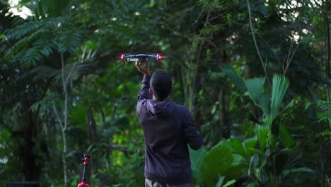 tourist using drone in jungle