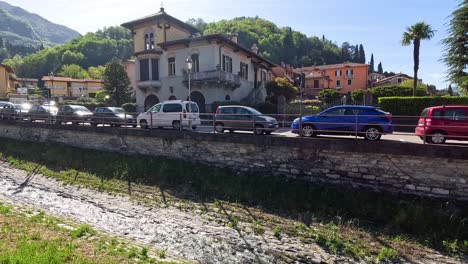 cars moving along a scenic road