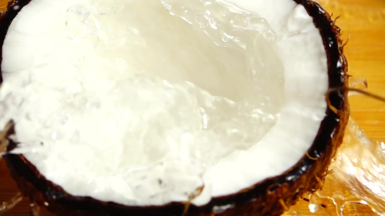 Juicy coconut flesh. Slow motion.