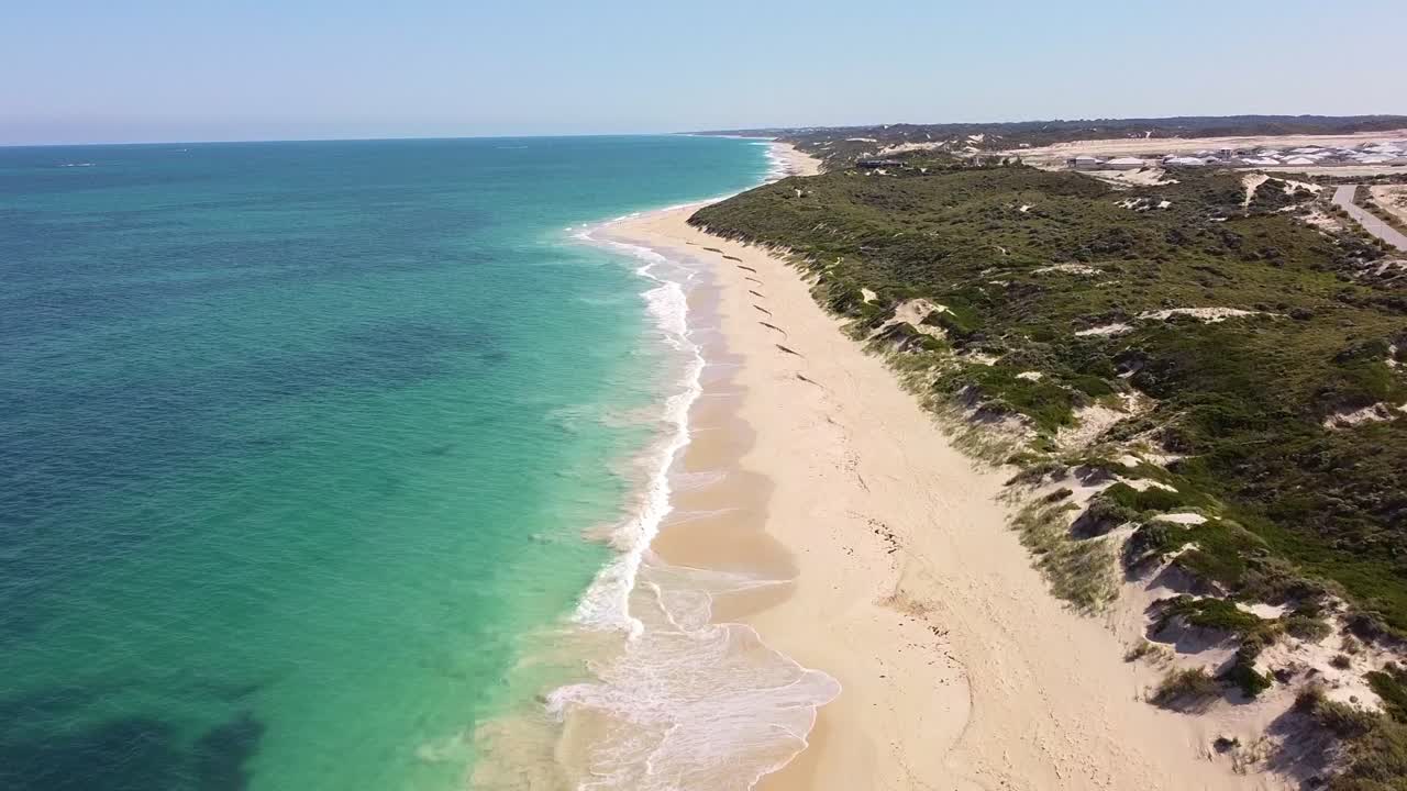 Aerial View of a Stunning Coastal Landscape with White Sand Beach and Turquoise Water
