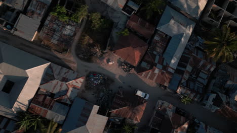 aerial view of zanzibar's narrow streets and rustic buildings in gambian village