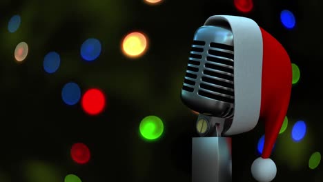 Santa-hat-over-microphone-against-colorful-spots-of-light-against-black-background