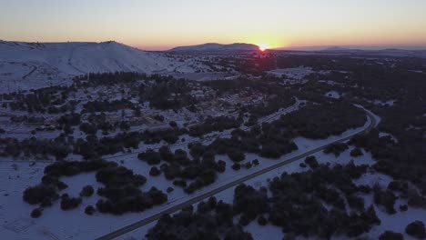 snowy village at sunrise/sunset