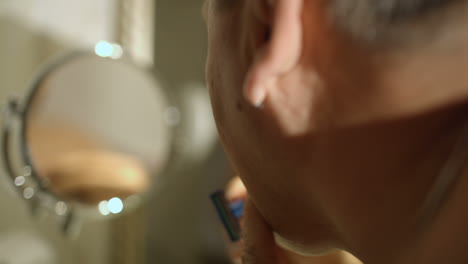 Mature-man-shaving-in-the-bathroom