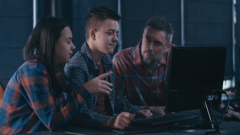 Students and Teacher Working on a Computer