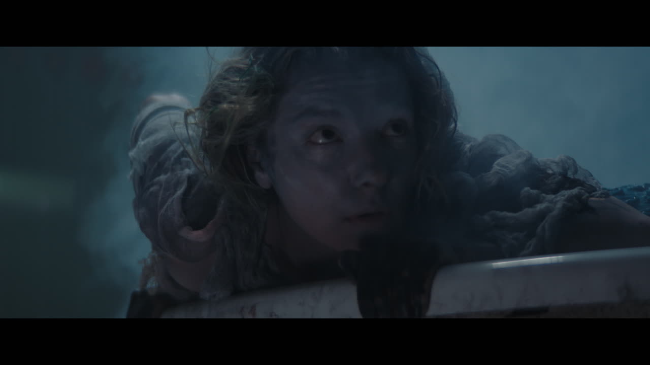 A girl meets a siren hat appears form the bathtub with hot water