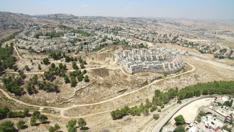 aerial view of a settlement in an arid hilly landscape