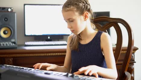 little girl rehearsing a song in home music studio.