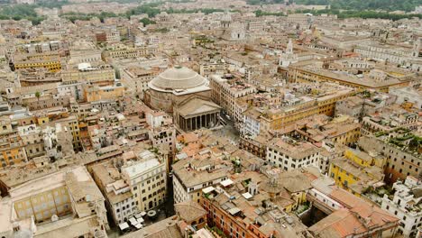 panoramic drone shot shows rome’s pantheon in the heart of a dense historic city