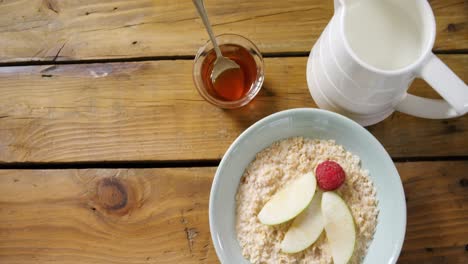 fruit cereal and milk on wooden table 4k