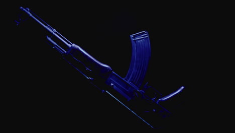 machineguns on the dark background and in blinking red and blue light rotate in slowmotion