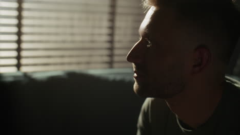 man sitting in profile view