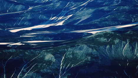 breathtaking view of mountainous terrain with glacial rivers in daytime