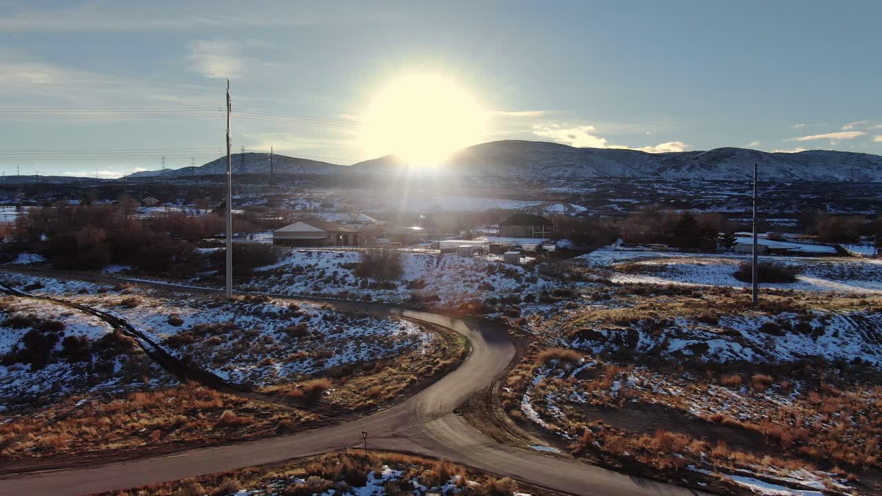 Aerial View of Snowy Landscape at Sunset