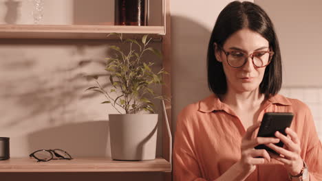 beautiful woman using smartphone at home
