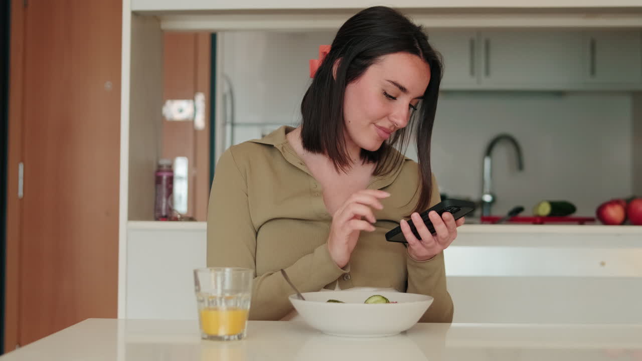 Woman Using Phone at Breakfast