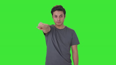 angry indian man challenging someone for fight green screen