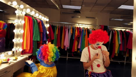 clowns preparing in a dressing room backstage