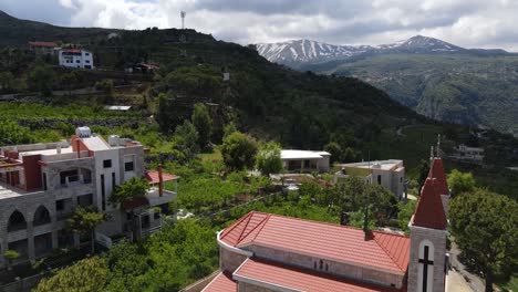 aerial view of village and christian church in kadisha valley, lebanon on sunny summer day