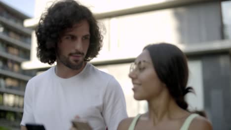 Happy-multiracial-couple-in-love-strolling-on-street