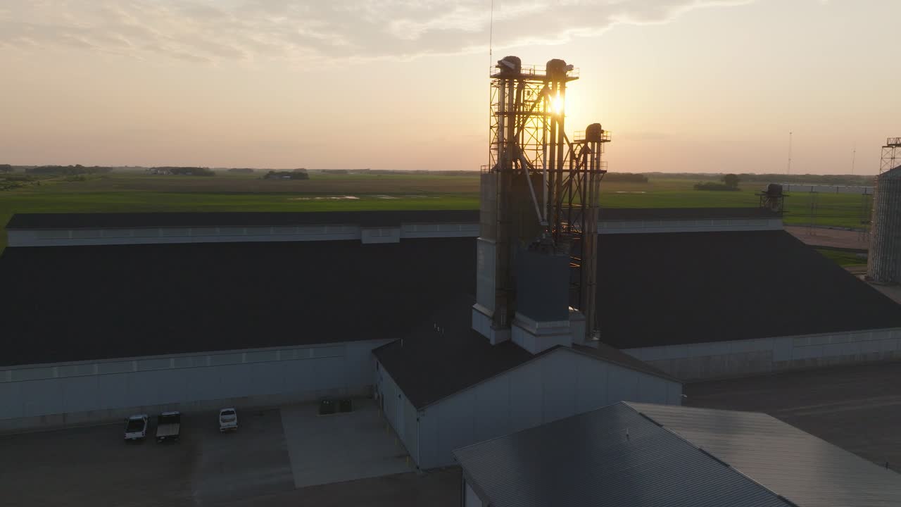 Fertilizer Bucket Elevator Silhouetted Near Brownstone, Minnesota, USA. - aerial shot